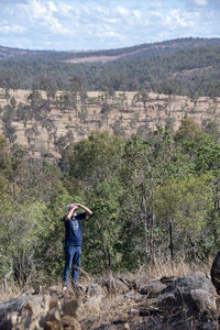 Full length of man standing on landscape