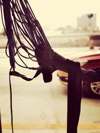 Close-up of metallic railing against sky