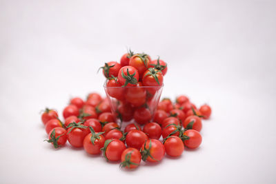 Close-up of cherries against white background