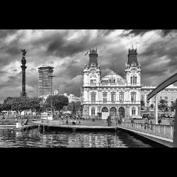 View of buildings against cloudy sky