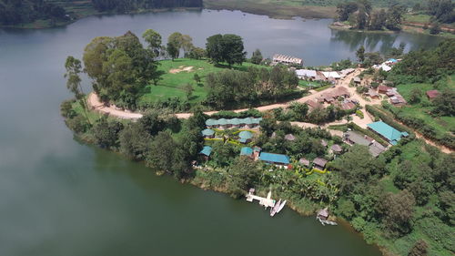 High angle view of river amidst trees against sky