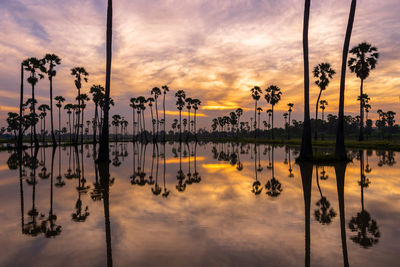 Scenic view of lake against sky during sunset