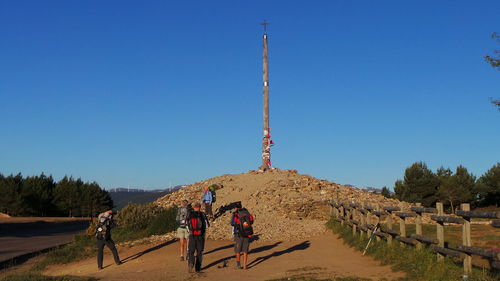 Tourist at clear blue sky