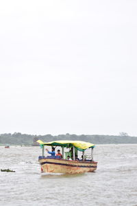 Boat in sea against clear sky