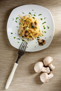 High angle view of pasta in plate on table