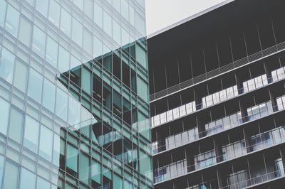 Low angle view of modern building in city against sky