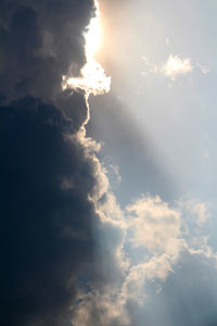 Low angle view of cloudy sky at sunset