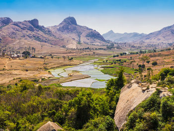 Scenic view of landscape and mountains against sky