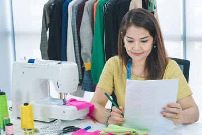 Young woman working on table