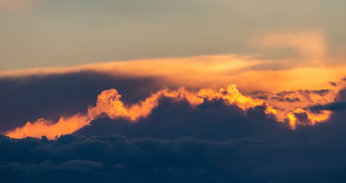 Low angle view of dramatic sky during sunset