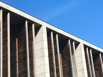 Low angle view of building against clear blue sky