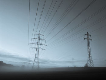 Dynamic power lines in a foggy landscape