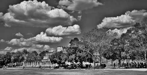 Panoramic view of people in city against sky