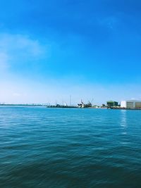 Scenic view of sea against blue sky