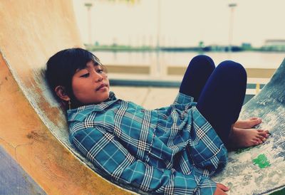 Girl sitting on sofa at home