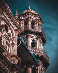 Low angle view of historical building against blue sky