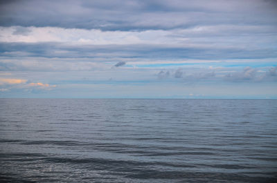 Scenic view of baltic sea against cloudy sky at dusk