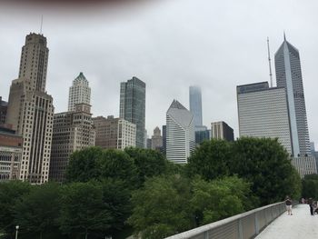View of modern buildings in city against sky