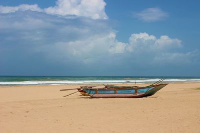 Scenic view of sea against cloudy sky