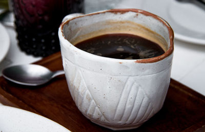 High angle view of coffee cup on table