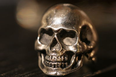 Close-up of artificial skull on table