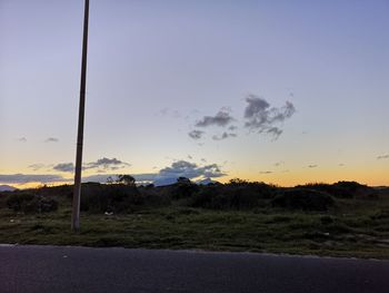 Scenic view of field against sky during sunset