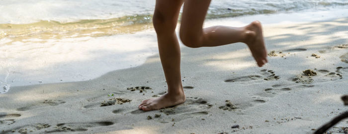 Low section of person on beach