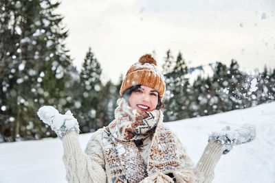 Portrait of woman in snow outdoors