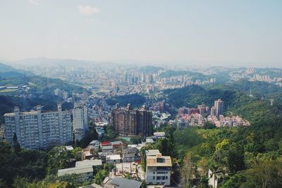 Aerial view of cityscape against sky
