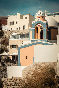 View of church against buildings