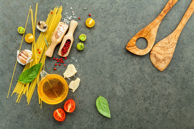 Directly above shot of food by wooden spatulas on table