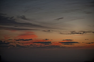 Low angle view of dramatic sky during sunset