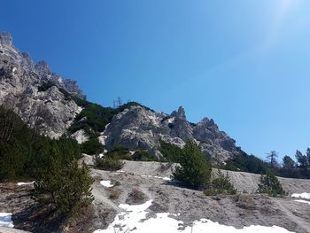 Scenic view of rocky mountains against clear blue sky