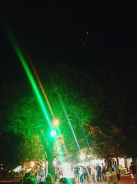 Illuminated ferris wheel at night