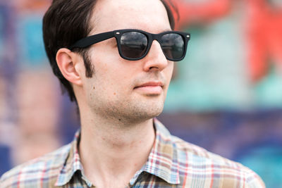 Portrait of young man wearing sunglasses