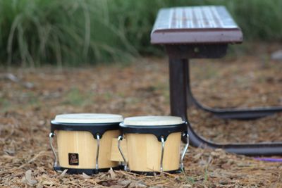 Bongo drums by picnic table on field