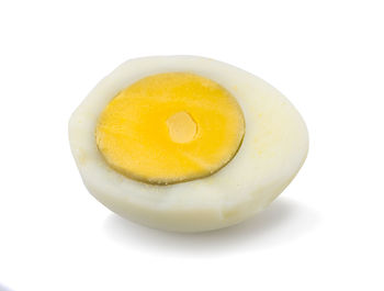 High angle view of yellow egg against white background