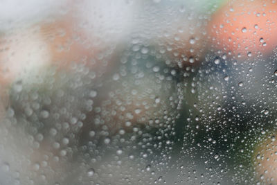 Full frame shot of wet glass window