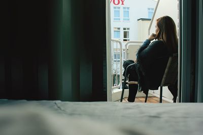 Young woman sitting on chair