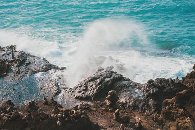 Waves splashing on rocks at shore