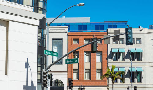 Low angle view of buildings against blue sky