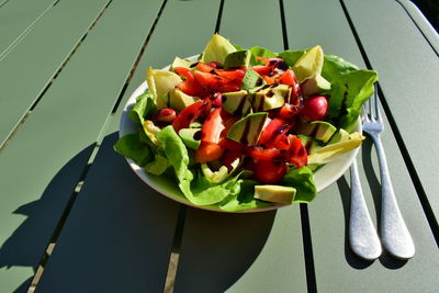 Close-up of chopped fruits in bowl on table