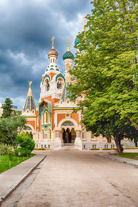 View of temple building against cloudy sky