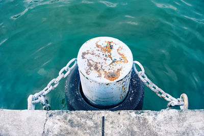 Rusty pillar in the river