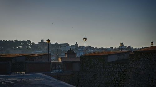 Cityscape against sky during sunset