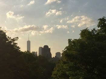 Buildings against cloudy sky