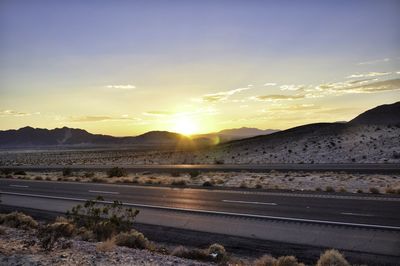 Scenic view of landscape against sky during sunset