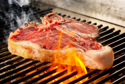 Close-up of meat on barbecue grill