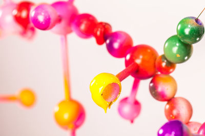 Close-up of colorful molecular structure over white background