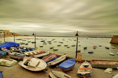 High angle view of sailboats moored at harbor